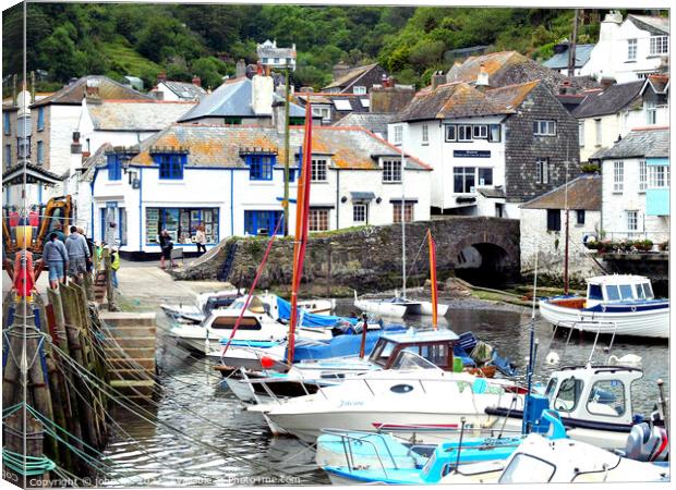 Harbour and town at Polperro in Cornwall. Canvas Print by john hill