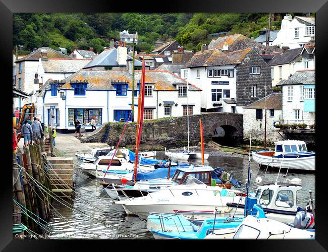 Harbour and town at Polperro in Cornwall. Framed Print by john hill