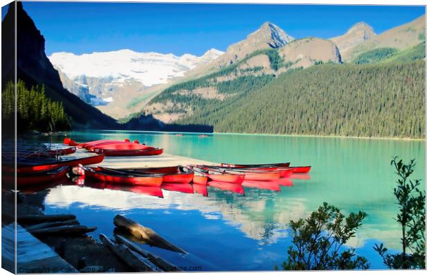 Canoes on Lake Louise Canvas Print by Colin Chipp
