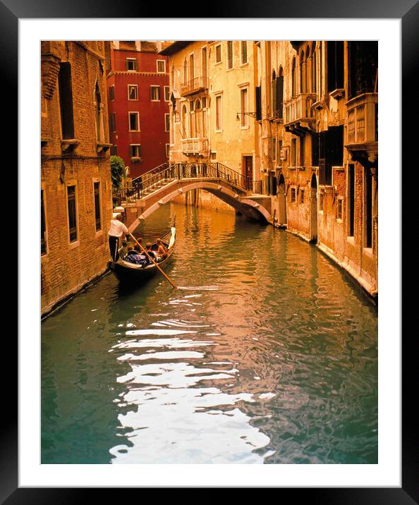 Gondola with tourist on backwater Framed Mounted Print by Philip Enticknap