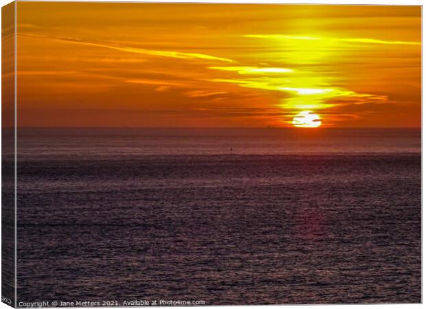 Sunset behind the Sea  Canvas Print by Jane Metters
