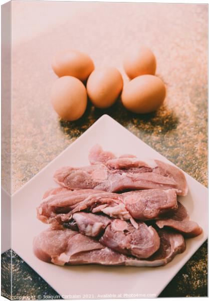 Raw meat and eggs for cooking Canvas Print by Joaquin Corbalan