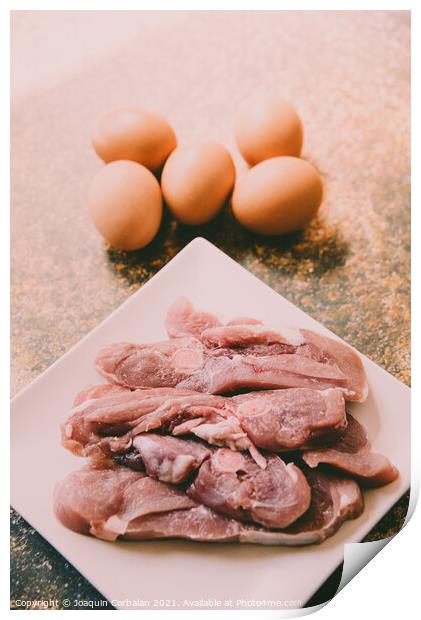 Raw meat and eggs for cooking Print by Joaquin Corbalan