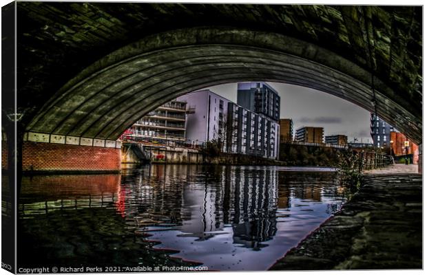 Manchester city centre in reflection Canvas Print by Richard Perks