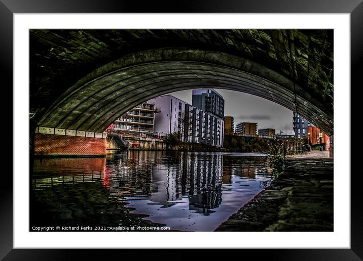 Manchester city centre in reflection Framed Mounted Print by Richard Perks