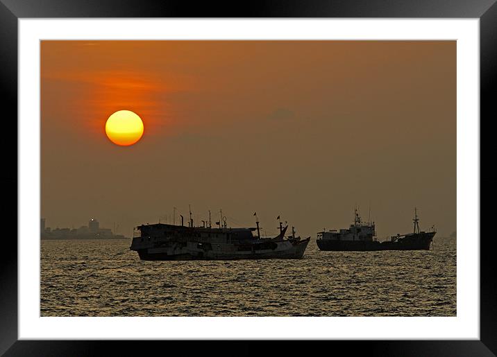 sunset boats Framed Mounted Print by Hassan Najmy