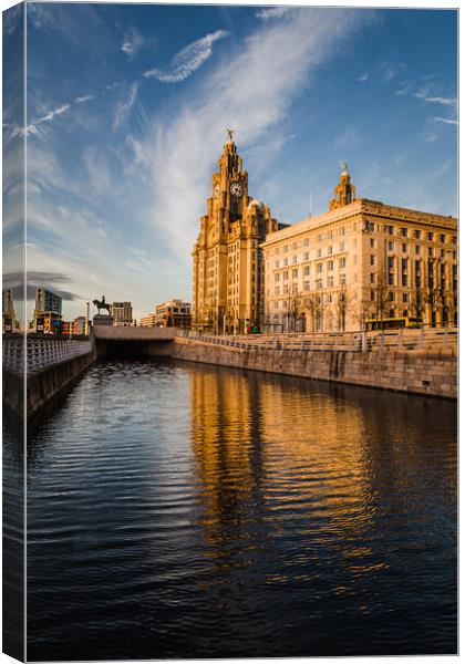 Reflections of the Liver Building at dusk Canvas Print by Jason Wells