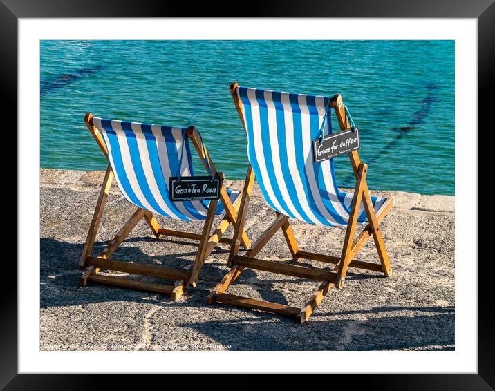 A pair of blue striped deckchairs with reserved signs, St. Ives harbour, Cornwall Framed Mounted Print by Photimageon UK