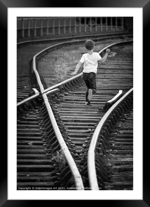 Boy running on old railway tracks in Bristol Framed Mounted Print by Delphimages Art
