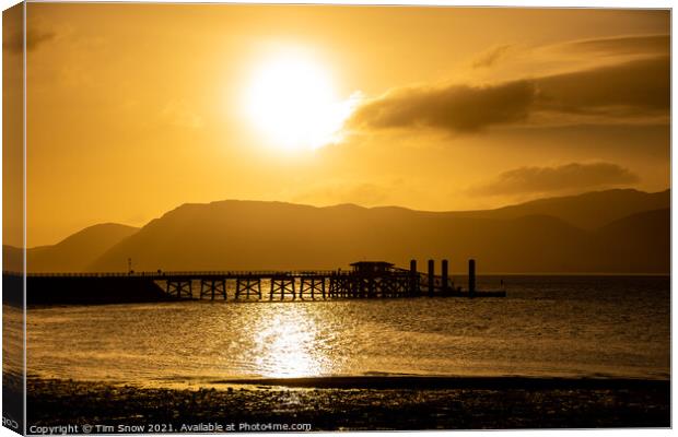 Sunrise over Beaumaris Pier on Anglesey Canvas Print by Tim Snow