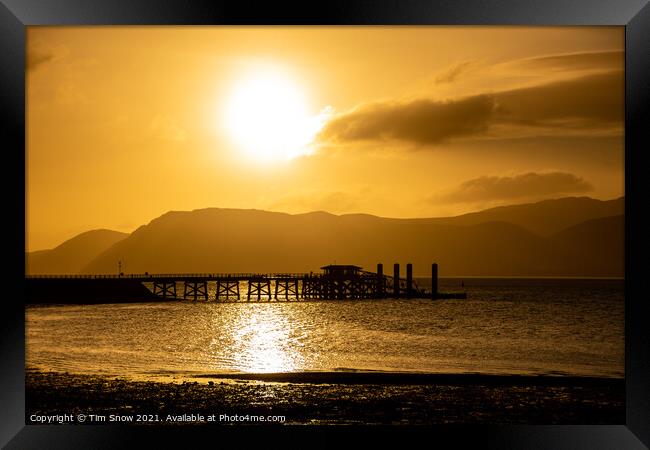 Sunrise over Beaumaris Pier on Anglesey Framed Print by Tim Snow