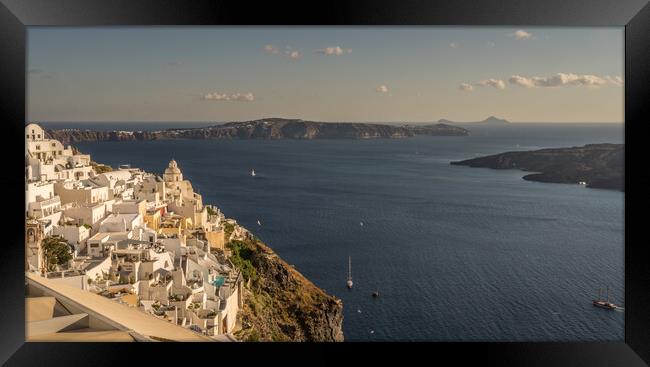 Cliff side view of Santorini Framed Print by Naylor's Photography