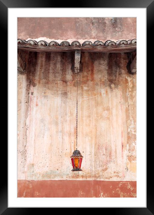 An old lantern hangs against a wall, Corfu, Greece Framed Mounted Print by Neil Overy