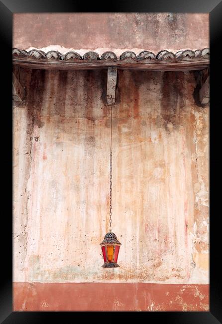 An old lantern hangs against a wall, Corfu, Greece Framed Print by Neil Overy