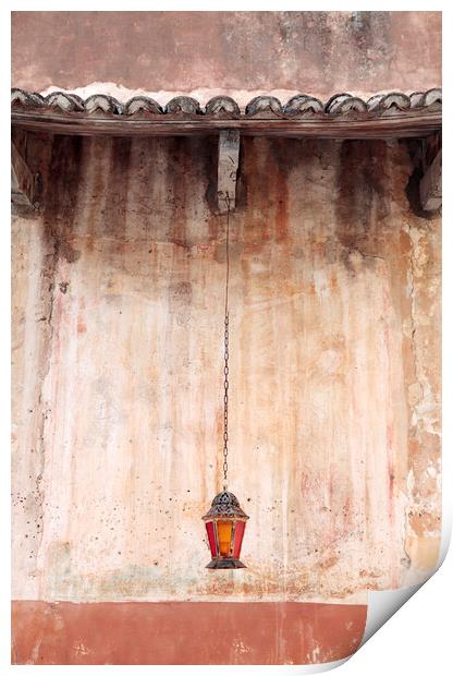 An old lantern hangs against a wall, Corfu, Greece Print by Neil Overy