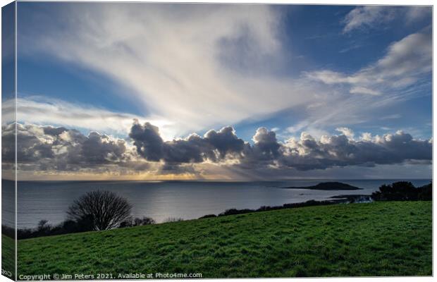 Spectacular light show in Looe Bay over Looe Island Cornwall Canvas Print by Jim Peters