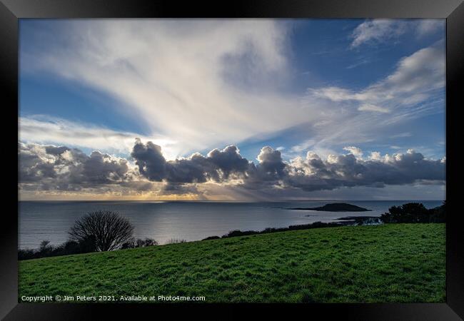 Spectacular light show in Looe Bay over Looe Island Cornwall Framed Print by Jim Peters