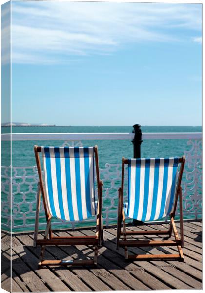 Pair of Deckchairs on Brighton Pier Canvas Print by Neil Overy