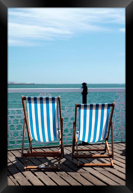 Pair of Deckchairs on Brighton Pier Framed Print by Neil Overy