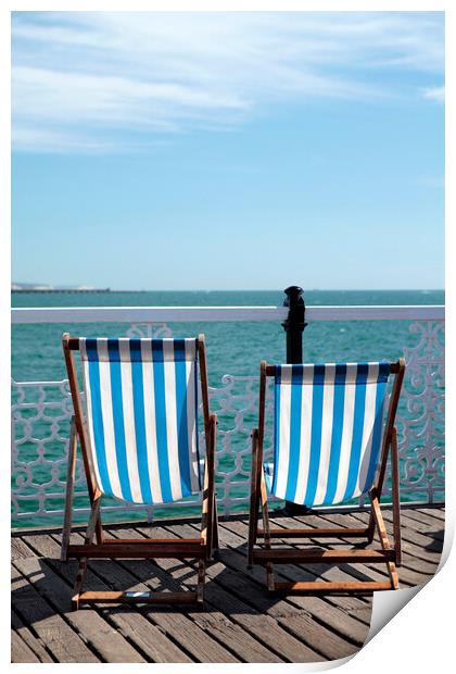 Pair of Deckchairs on Brighton Pier Print by Neil Overy