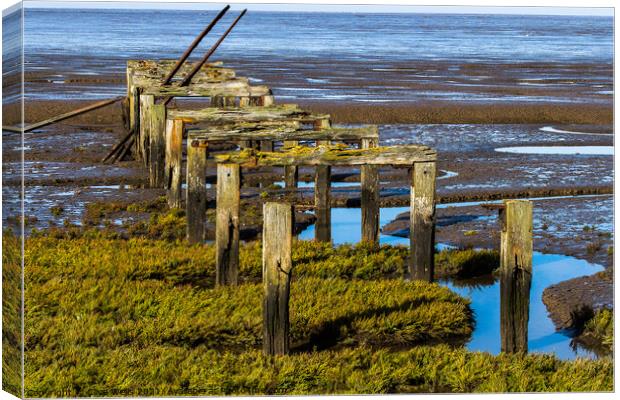 Old wooden pier Canvas Print by Clive Wells