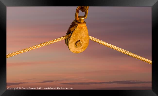 Rope on Pulley Against Blue Background Framed Print by Darryl Brooks