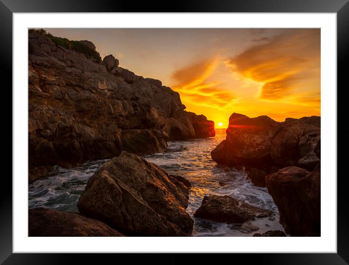 A sunrise between the rocks in a cove in La Renega, Oropesa Framed Mounted Print by Vicen Photo