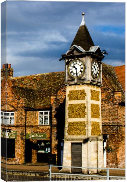 The Clock in Gaywood, Kings Lynn Canvas Print by Clive Wells