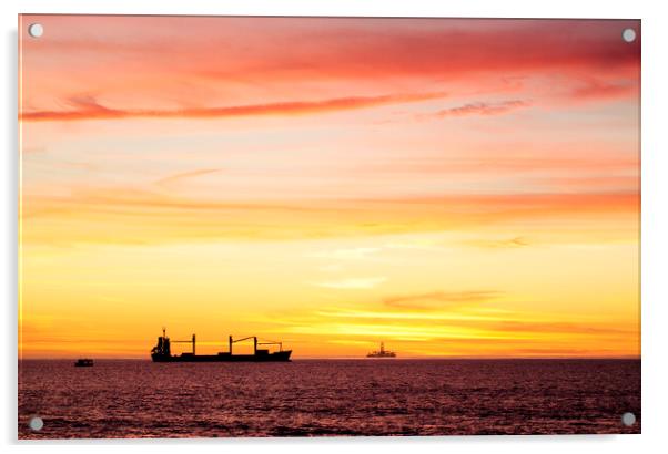 Sunset over ships waiting to enter Cape Town Harbour, South Africa Acrylic by Neil Overy