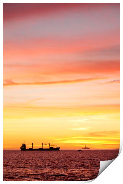Sunset over ships waiting to enter Cape Town Harbour Print by Neil Overy