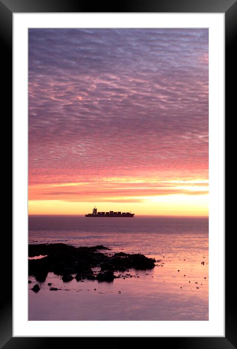 Sunset over ship waiting to enter Cape Town Harbour Framed Mounted Print by Neil Overy