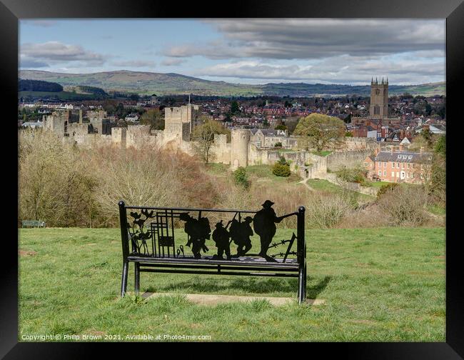 Overlooking The lovely town of Ludlow in Shropshire through a World war 1 monument bench - Landscape Framed Print by Philip Brown