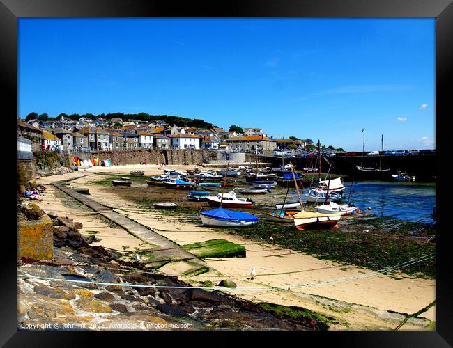 Mousehole harbour in Cornwall. Framed Print by john hill