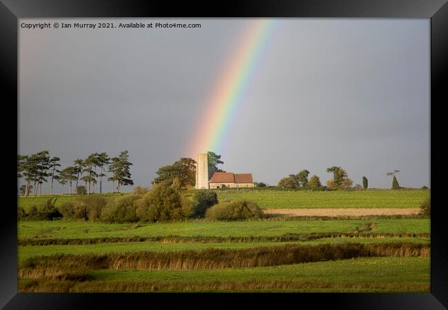 Rainbow shining on Ramsholt church Framed Print by Ian Murray