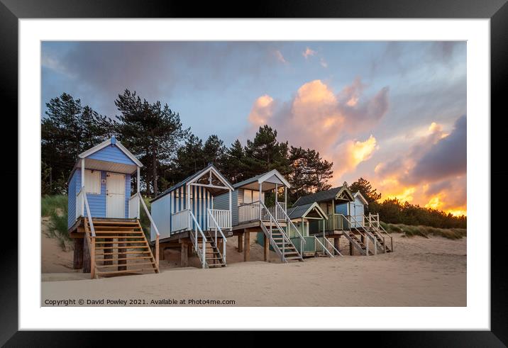 Evening Light on the Beach Huts at Wells Norfolk Framed Mounted Print by David Powley