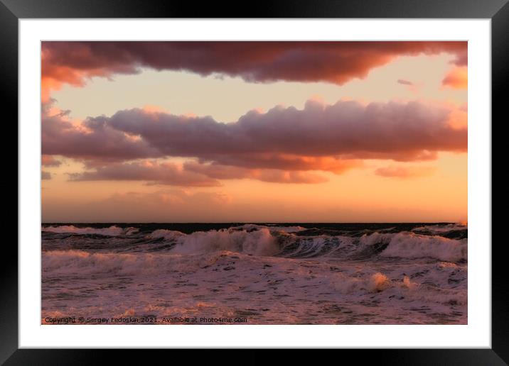 Cloudy sunset at the stormy sea. Framed Mounted Print by Sergey Fedoskin
