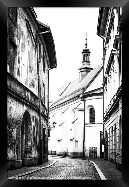 Cobbled Street & A Church In The Old Town In Kracow Framed Print by Peter Greenway