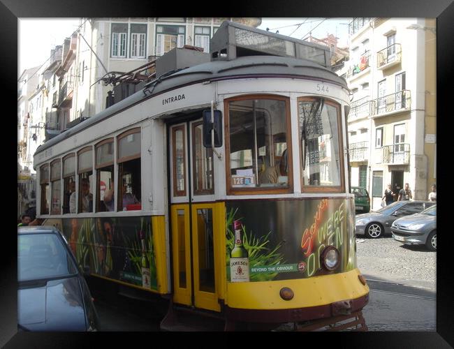 Lisbon Tram Framed Print by John Bridge