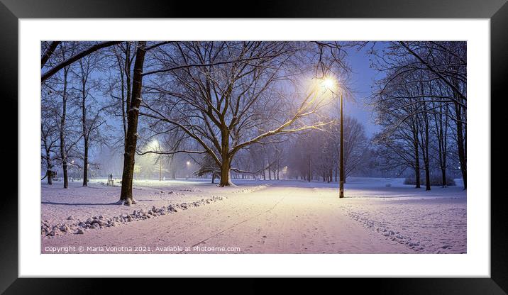 Street lights and covered in snow trees at night i Framed Mounted Print by Maria Vonotna