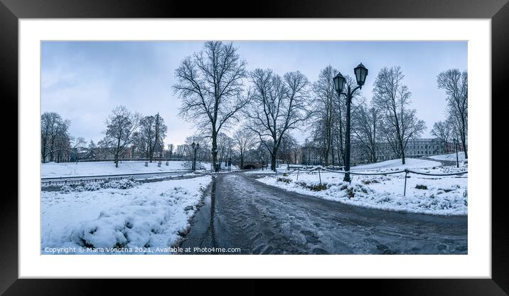 Covered in snow city park in winter in Riga, Latvia Framed Mounted Print by Maria Vonotna