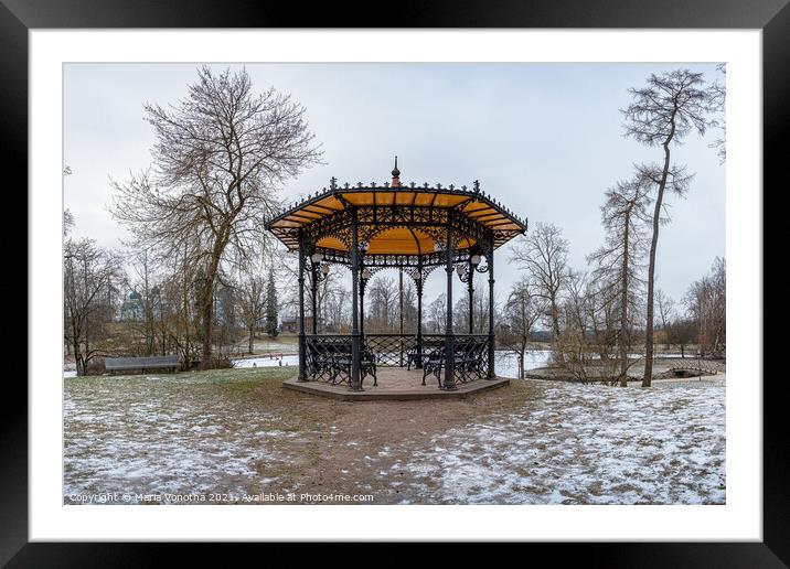 Metal openwork gazebo in public park in winter Framed Mounted Print by Maria Vonotna