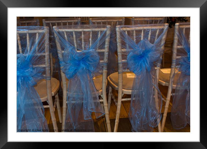 Chairs with blue ribbons Framed Mounted Print by Clive Wells