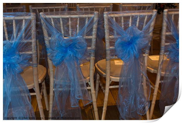Chairs with blue ribbons Print by Clive Wells