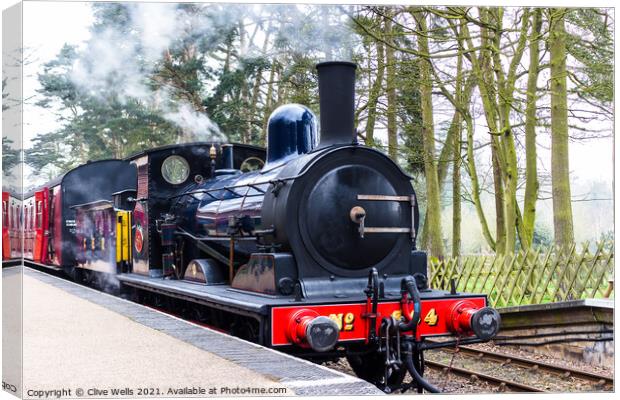 Steam train at Holt Station in North Norfolk Canvas Print by Clive Wells