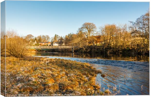 Winter scene on a scottish River, the Water of Ken, with a suspension bridge Canvas Print by SnapT Photography