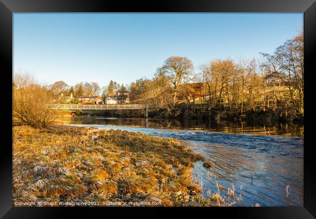 Winter scene on a scottish River, the Water of Ken, with a suspension bridge Framed Print by SnapT Photography