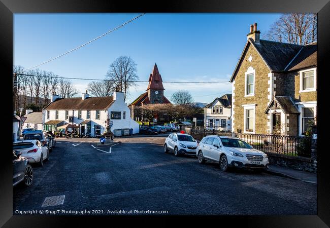 Town centre of Dalry with Clachan Inn, bank, parish church in the background Framed Print by SnapT Photography