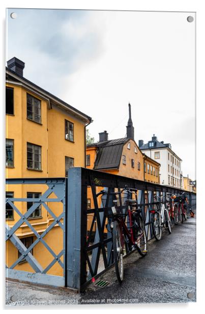 Bicycles parked in the street with colorful houses in Sodermalm  Acrylic by Juan Jimenez