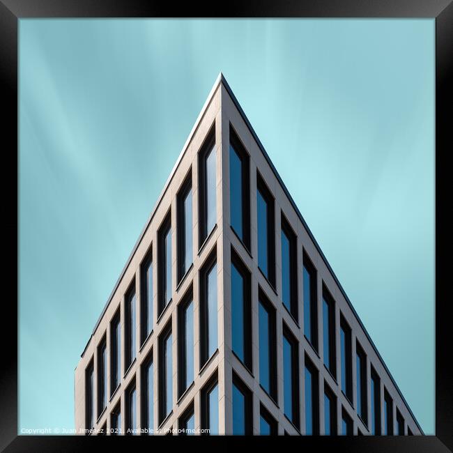 Abstract Detail of Minimalist Building Against Teal Blue Sky Framed Print by Juan Jimenez