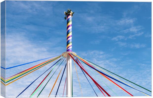 The Woved Coloured Ribbon Patterns On The Maypole Canvas Print by Peter Greenway